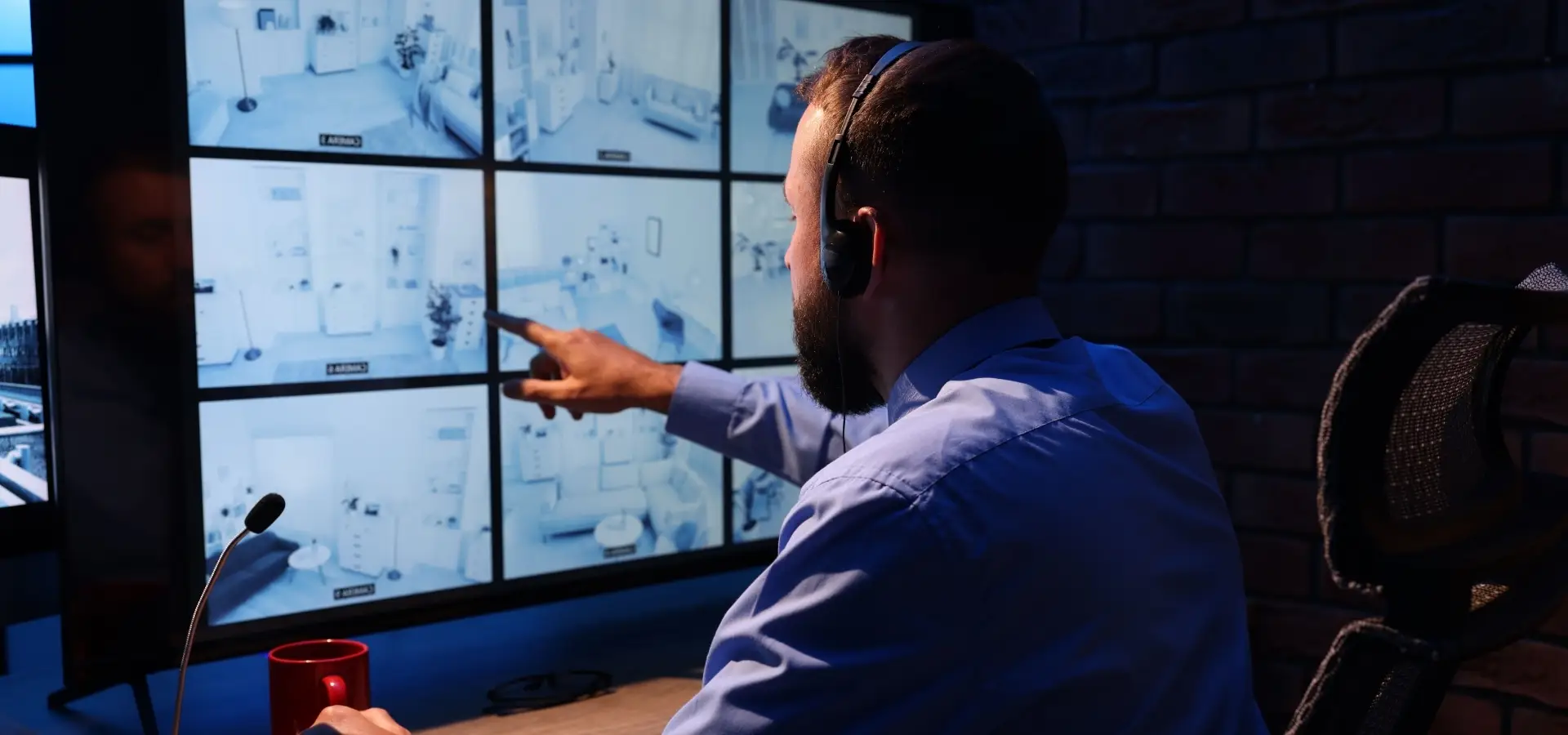 A man reviewing security camera footage.