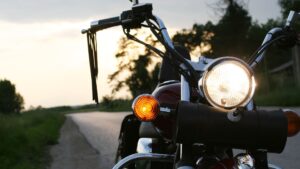 A motorcycle with a whip on the handlebar