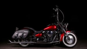 A red motorcycle with a high handlebar