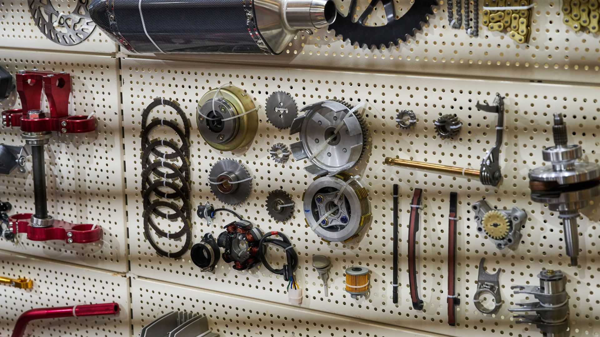 An assortment of illegal motorcycle parts on a wall.