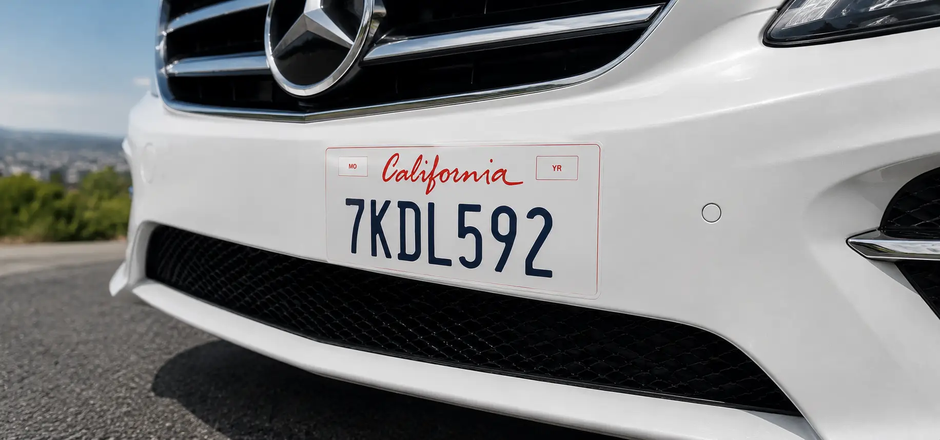 A California license plate wrap on a white car.