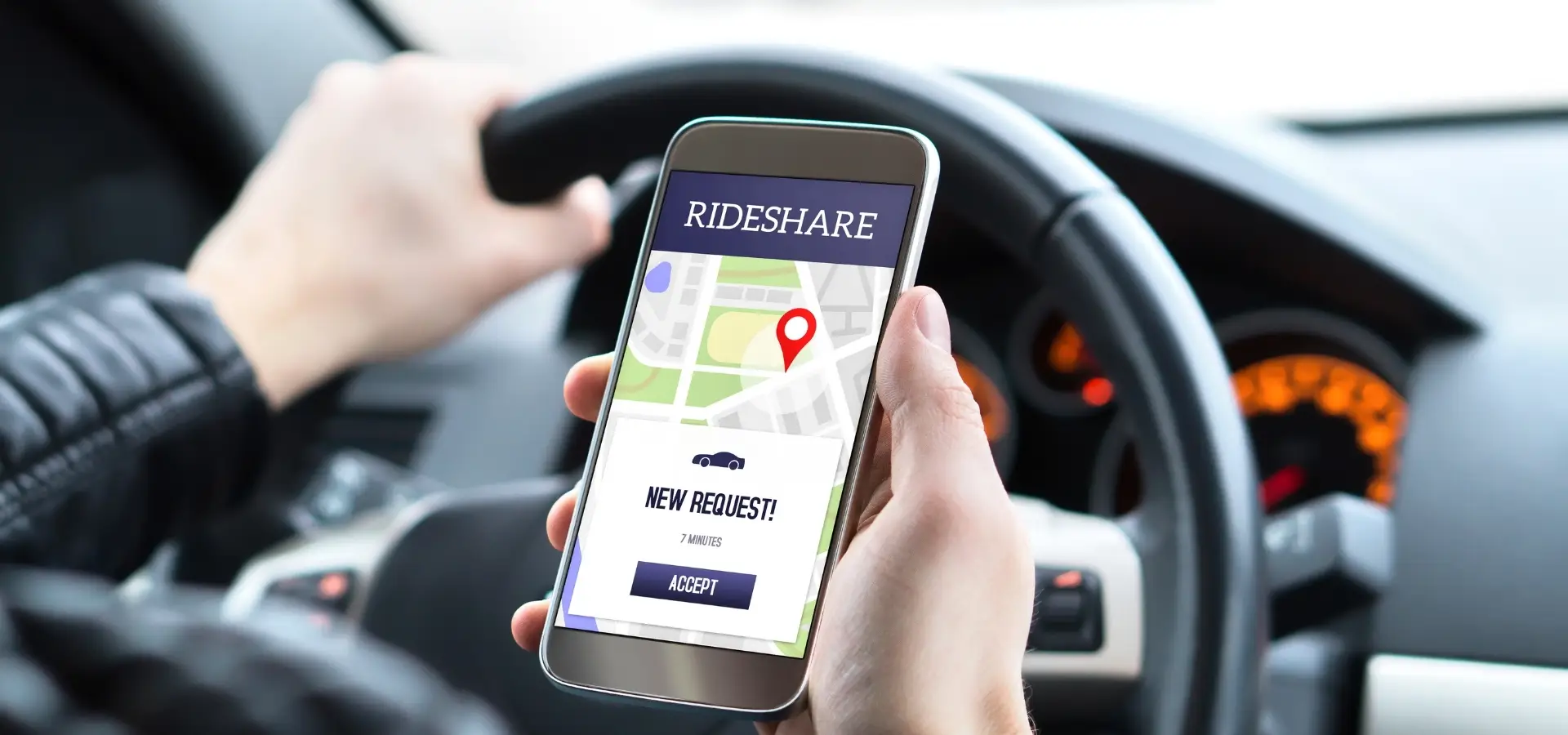 An Uber Driver checking his GPS on his phone.