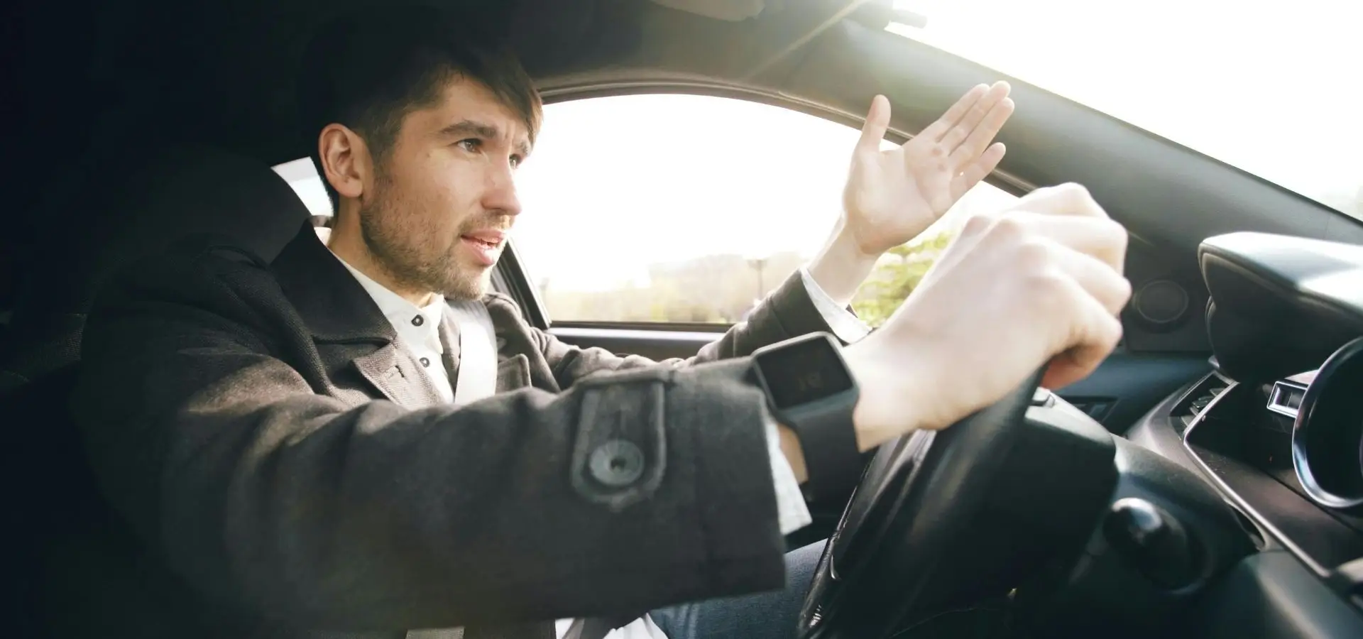 A man getting frustrated at a slow driver.