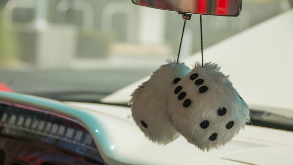 fuzzy dice on a car's rearview mirror