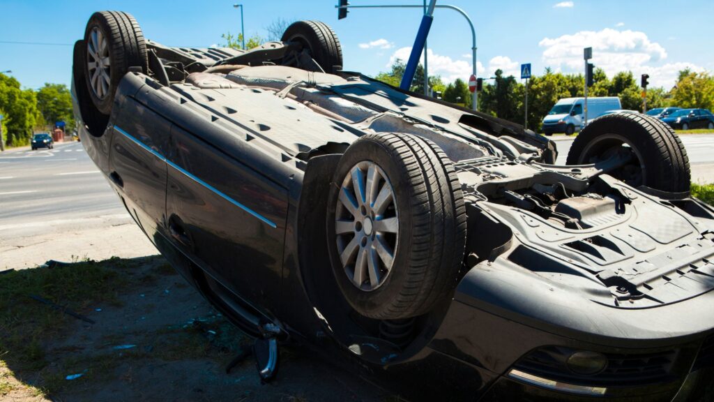 A car overturned on its roof.