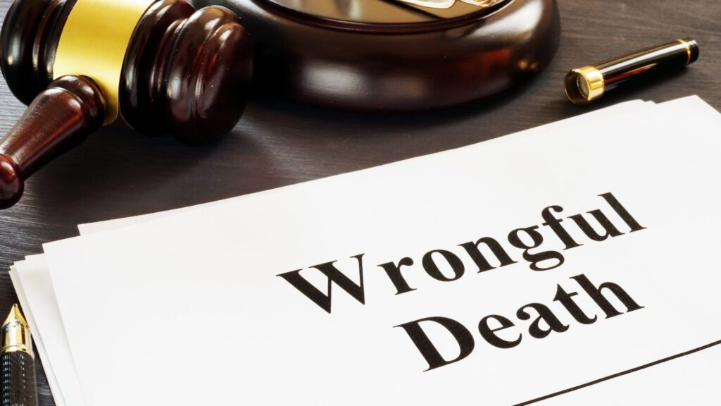 A gavel and a sheet of paper labeled "Wrongful Death".