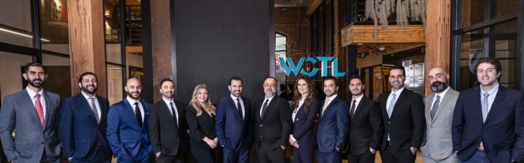 A row of attorneys from West Coast Trial Lawyers all lined up.