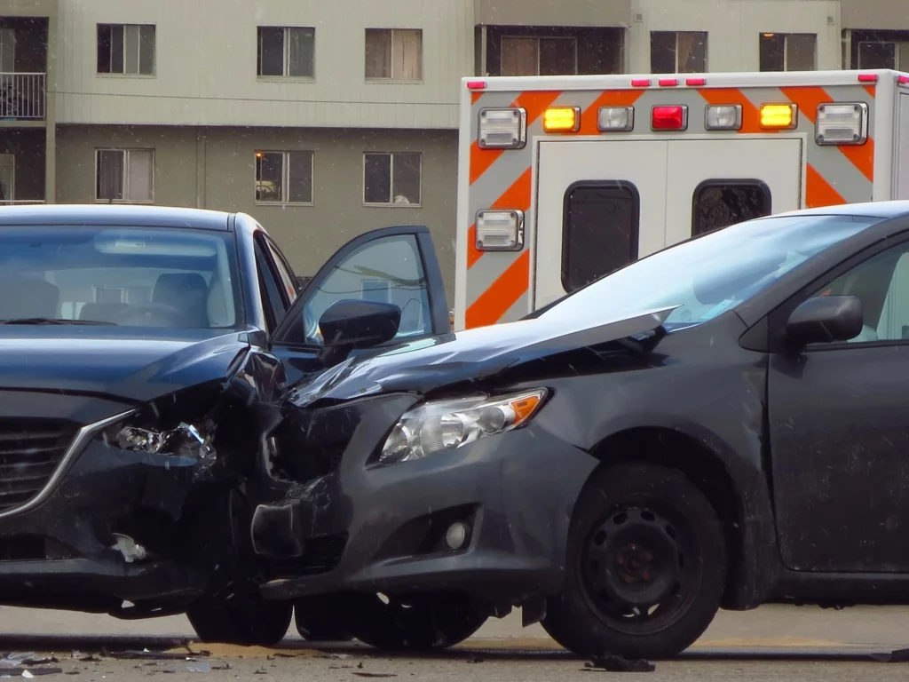 An ambulance at a car accident scene.
