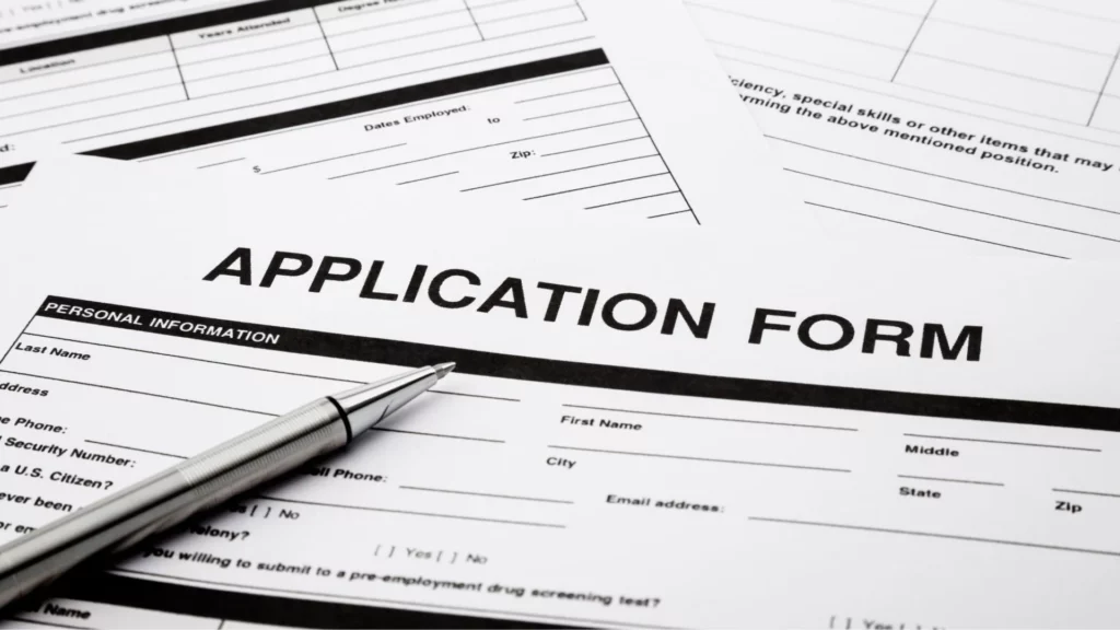 An application form with a pen.