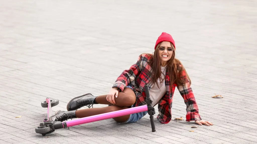 A woman who fell while riding an electric scooter.