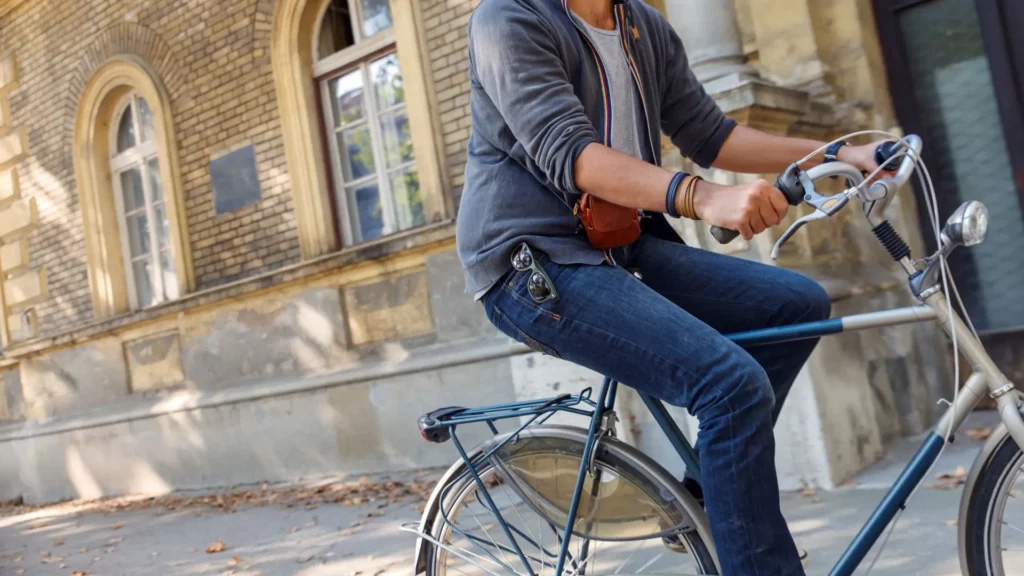 A man riding a bike.,