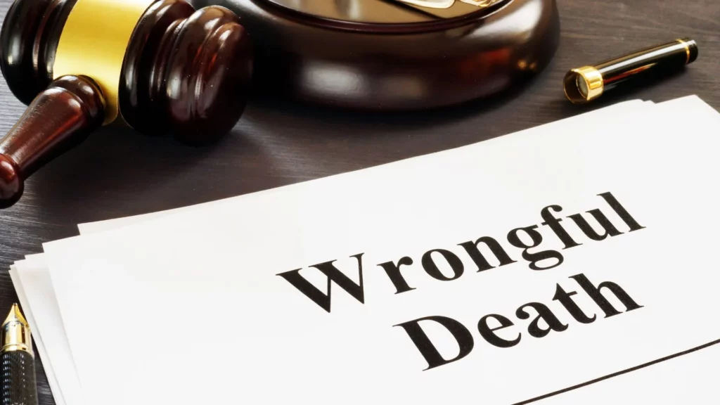 A gavel and a sheet of paper labeled "Wrongful Death".
