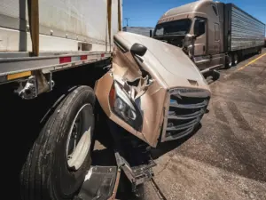 A truck crash where it lost the hood of the truck.