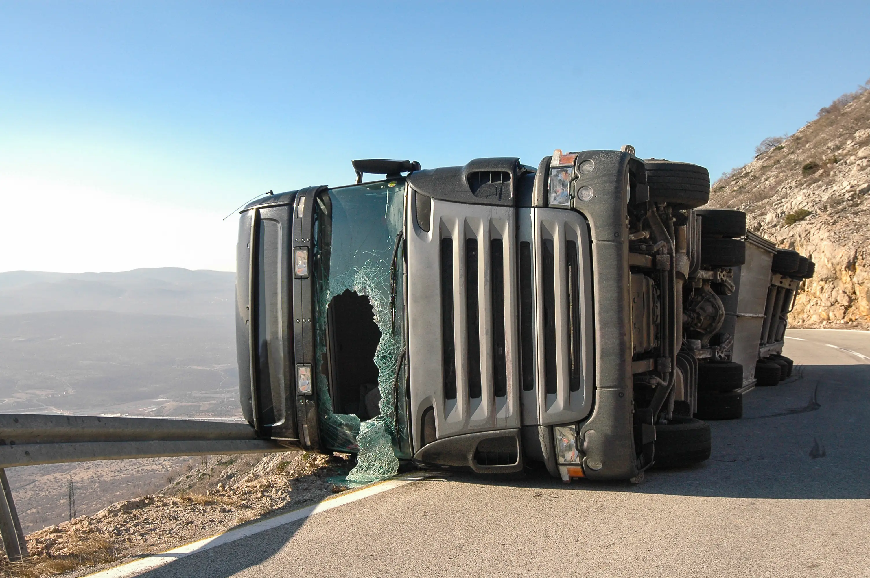 A truck rolled over on its side.