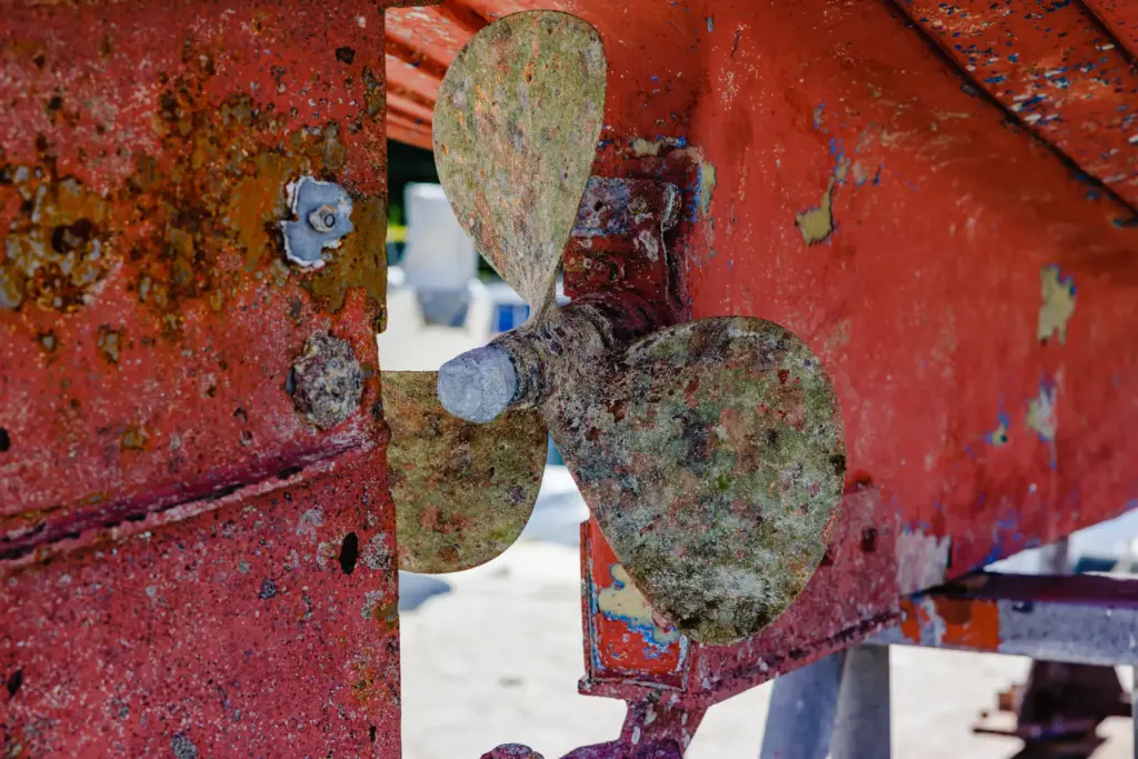 A rusted boat propeller.