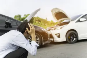 A man panicking after being involved in a car accident.