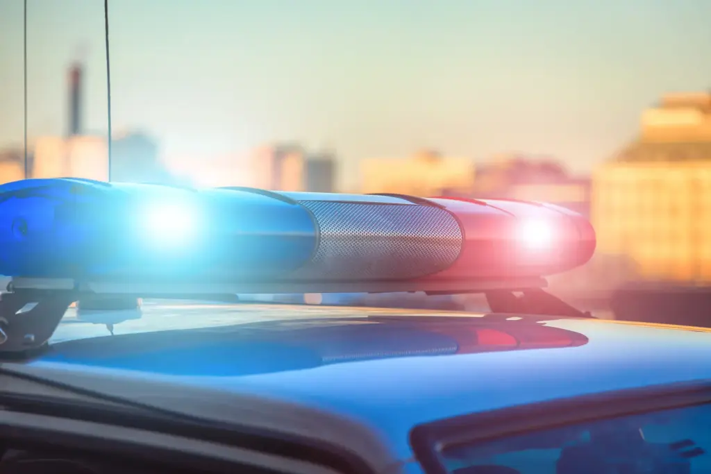 A Police car lights shinning brightly.