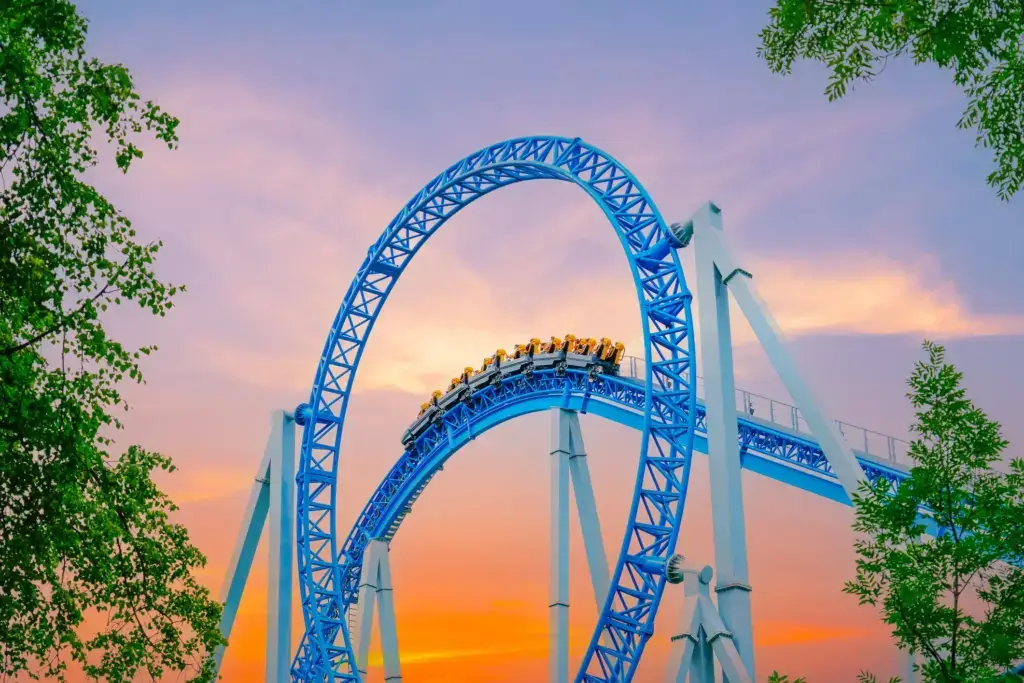 A shot of a rollercoaster while the sun is setting.