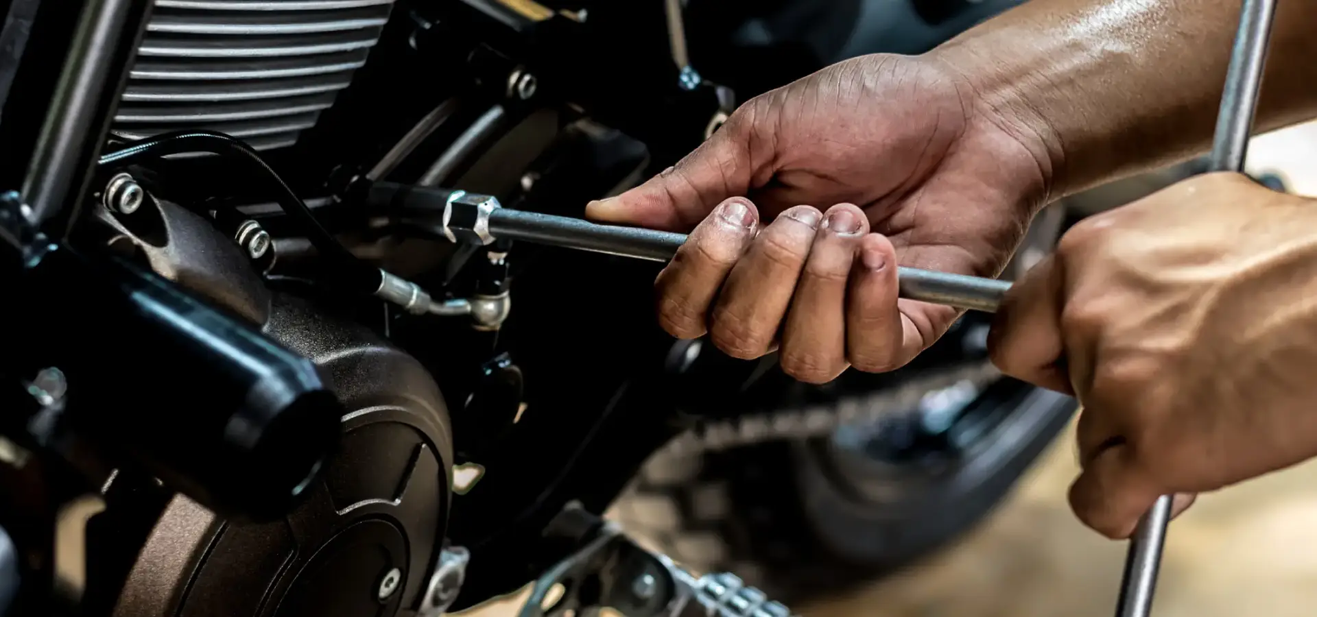 A person fixing a minibike engine.