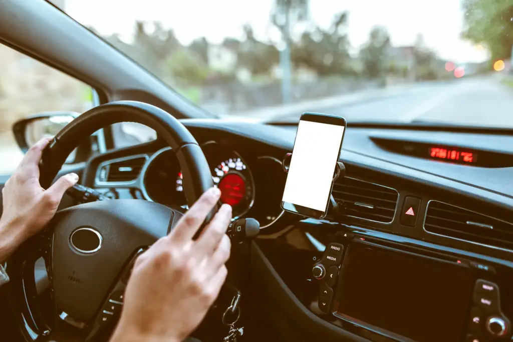 A person with a hands free phone set up.