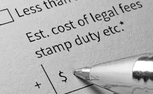 A closeup of legal fees and a pen.