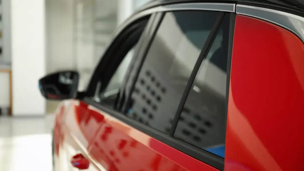 A red car with tinted windows.