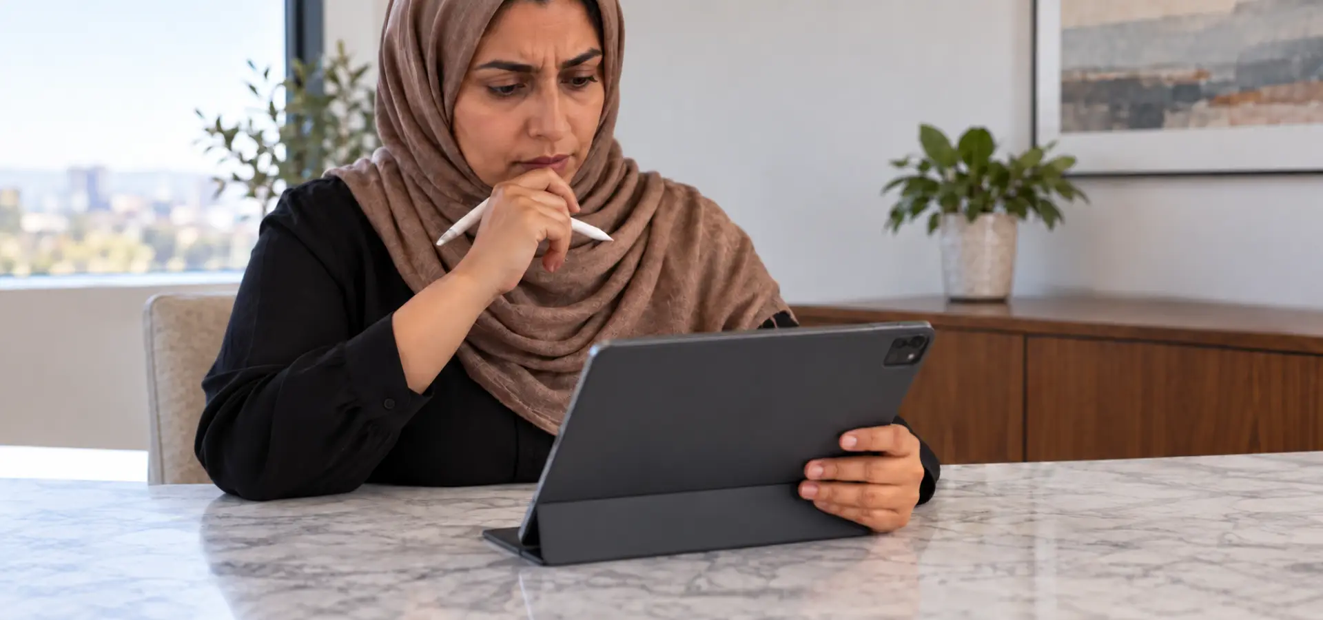 A woman examining a settlement release form.