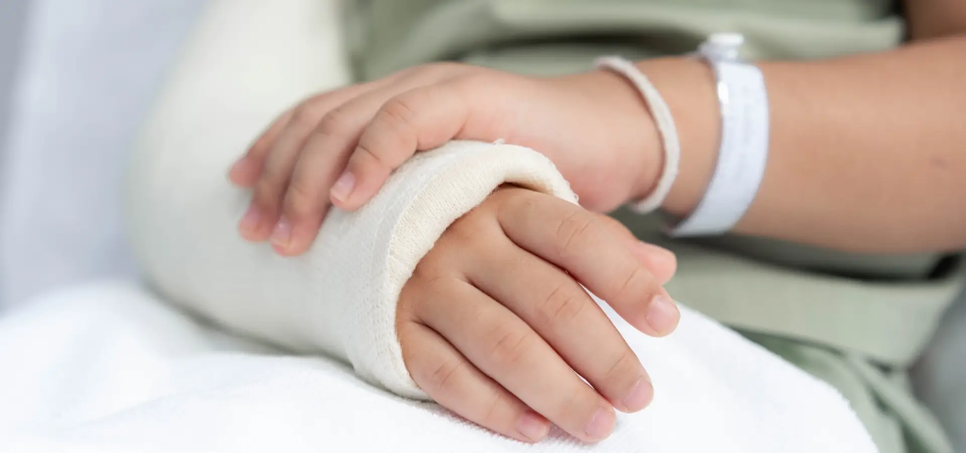 A person in the hospital with a broken arm.