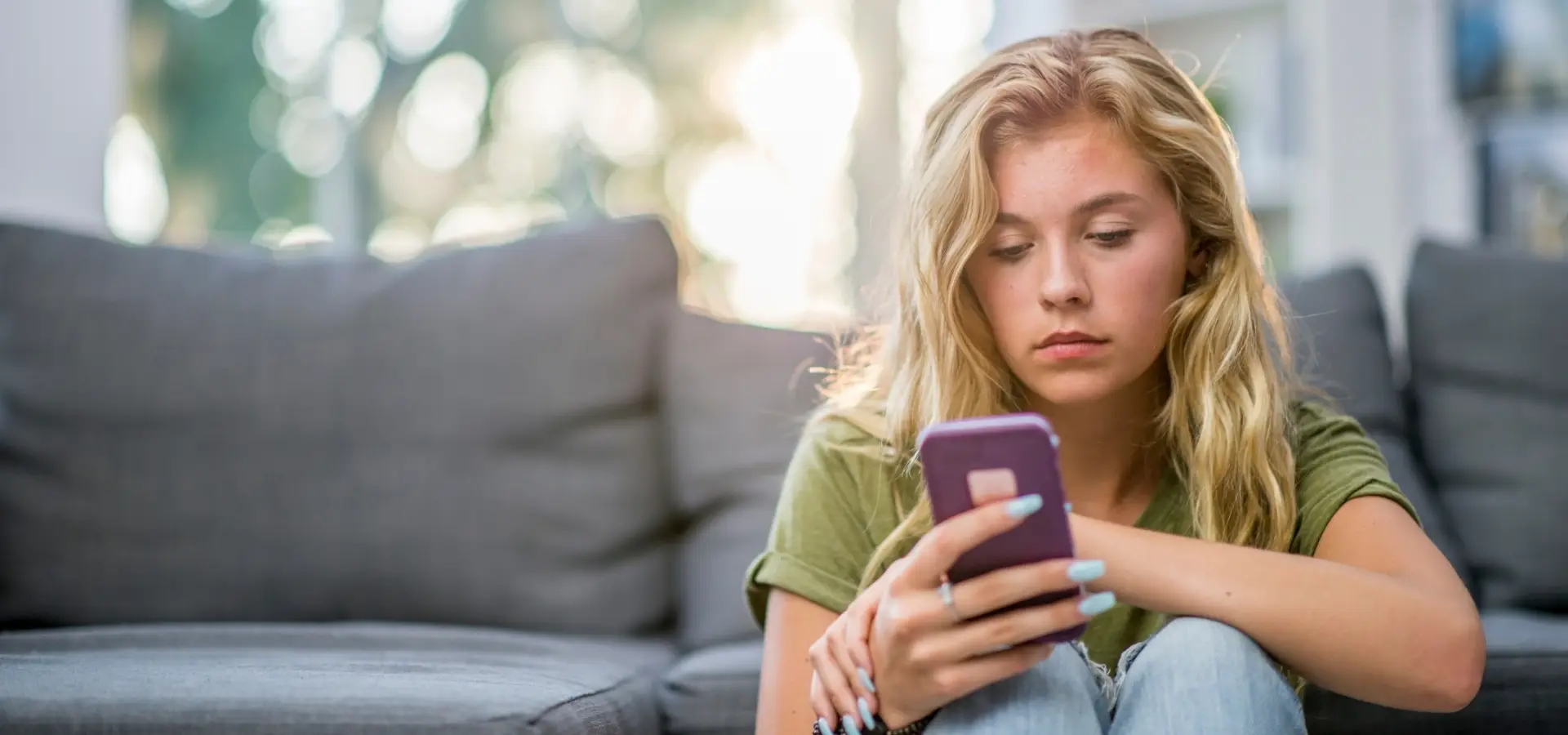 A woman doing research on her phone.