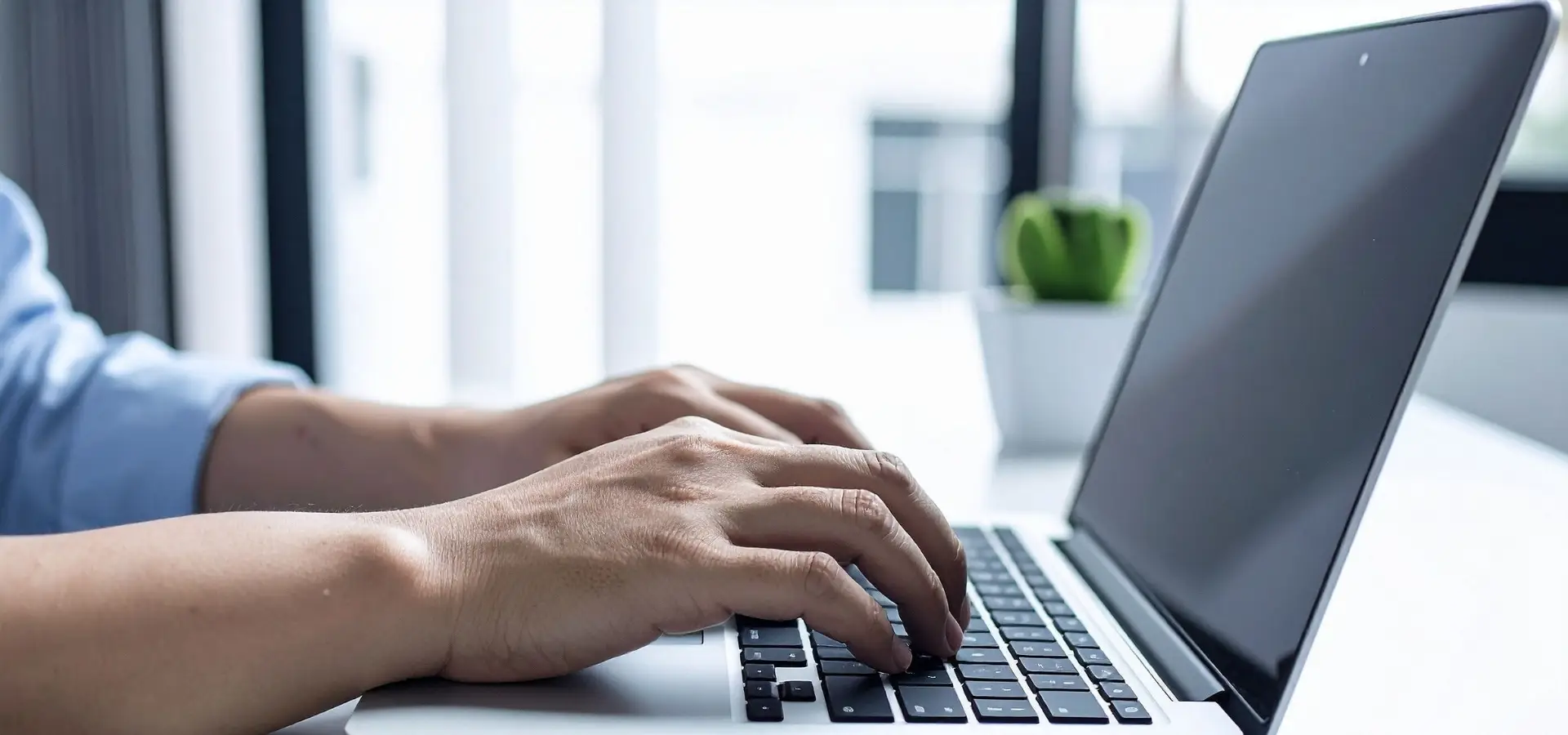 A man typing on a laptop and researching for lawyers.