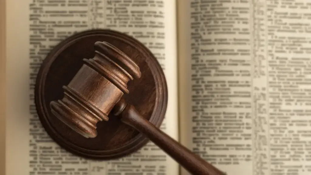 A gavel on top of a law book.