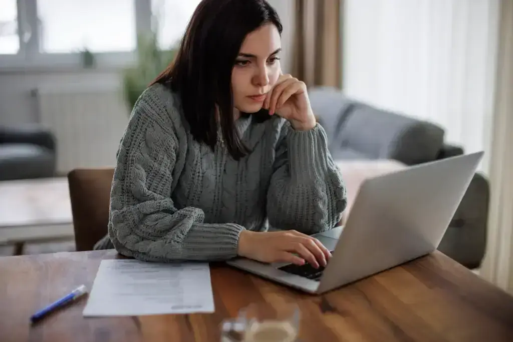 A woman researching what kind of lawyer she needs.