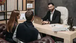 A lawyer talking to his clients.