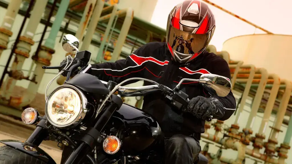 A motorcyclist driving on a road.