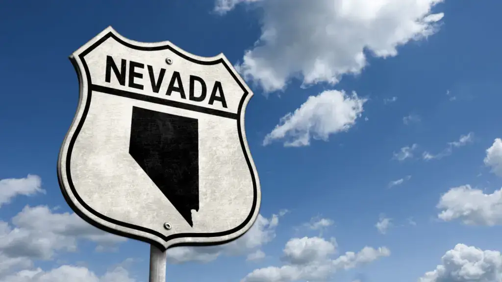 A Nevada sign on the road.