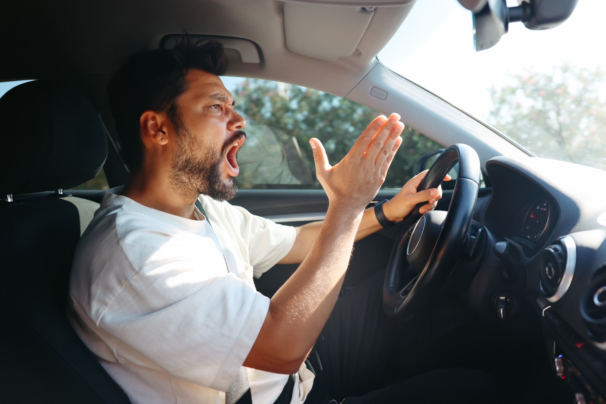 An angry driver yelling. 
