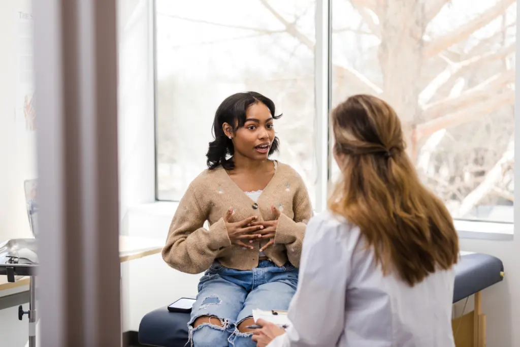 A woman talking to her doctor.