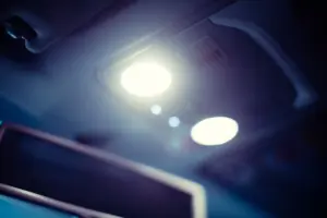 A car's interior lights being on.