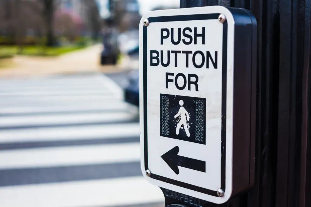 A closeup show of a crosswalk button.