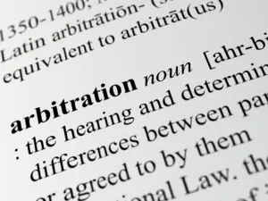 A close up definition of the word "arbitration."