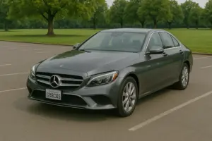 A gray Mercedes C Class parked at a park.