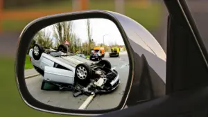 A mirror shot catching a rollover accident.