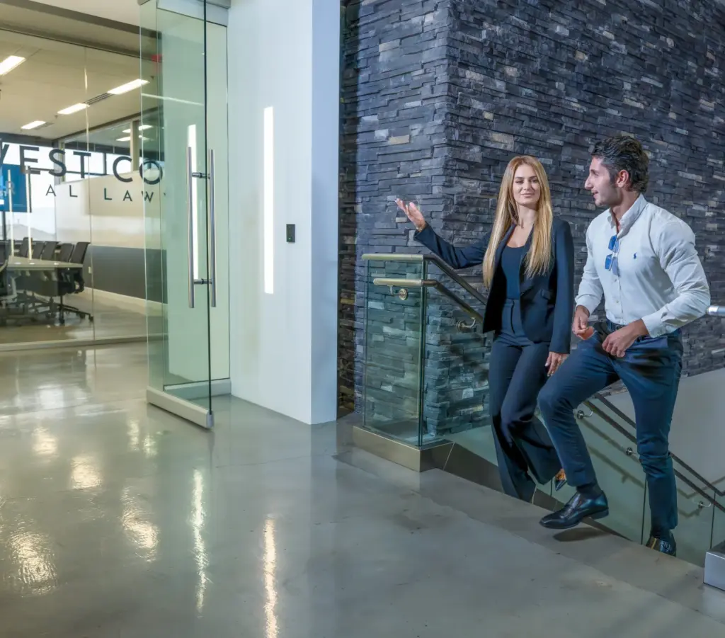 Liana guiding a client to her office.