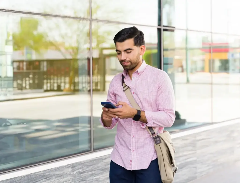 A person texting while walking.