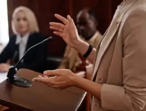 A woman on the stand testifying.