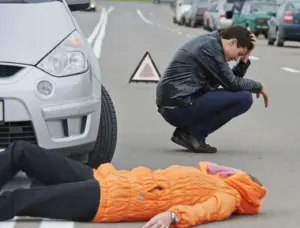 A man regretting his choices after running over a pedestrian.