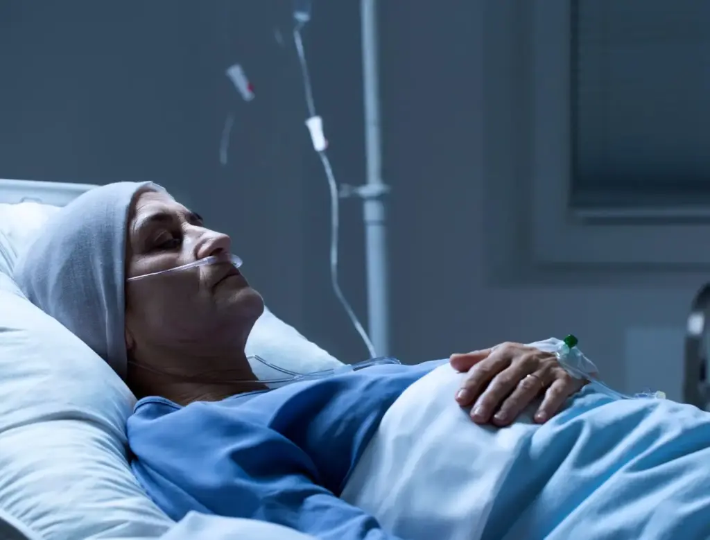 A hospital patient laying in the hospital.