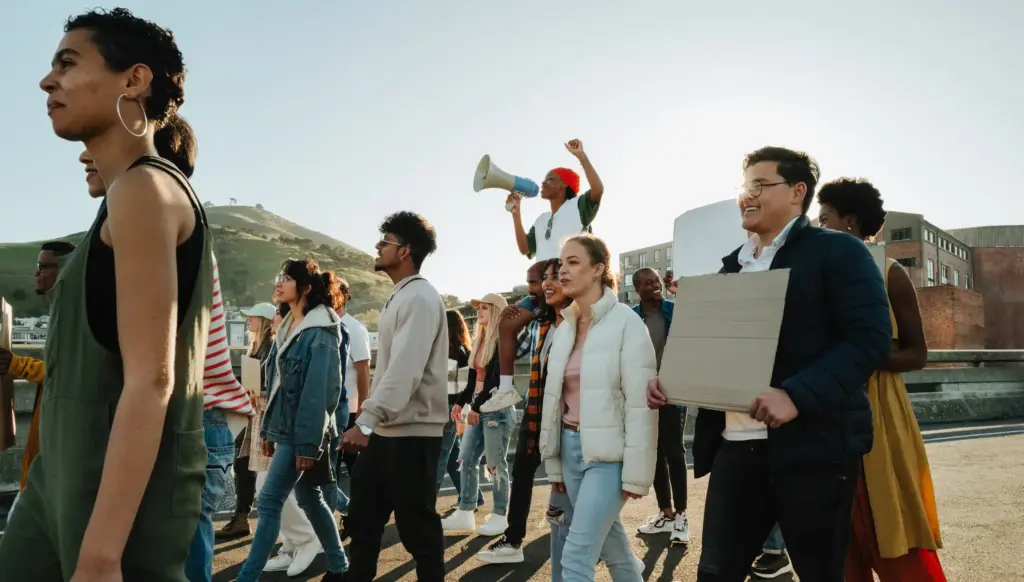 A group of protestors marching down the street.