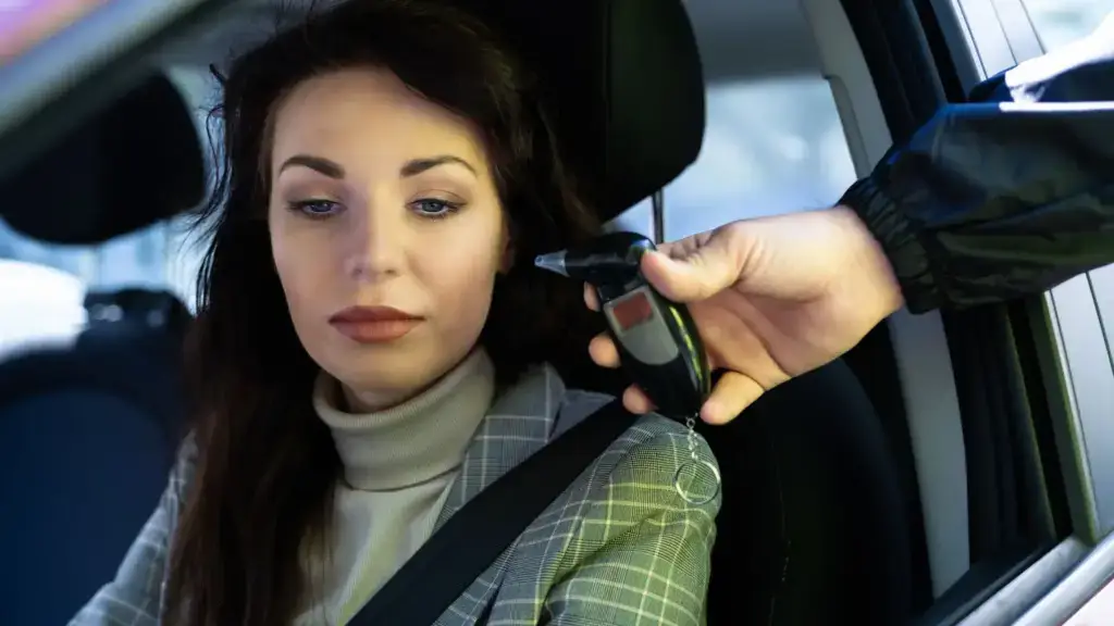 A woman being forced to take a DUI test.