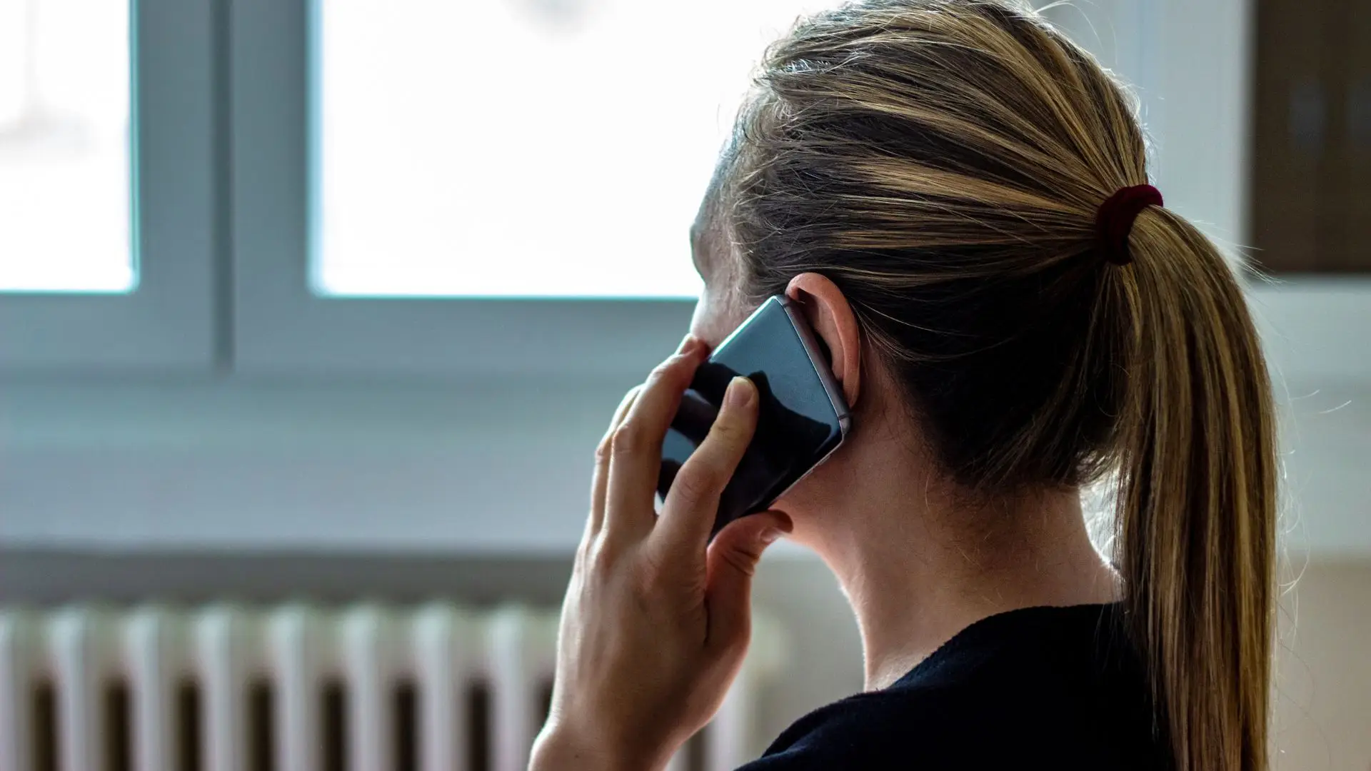 A woman on the phone with a lawyer.